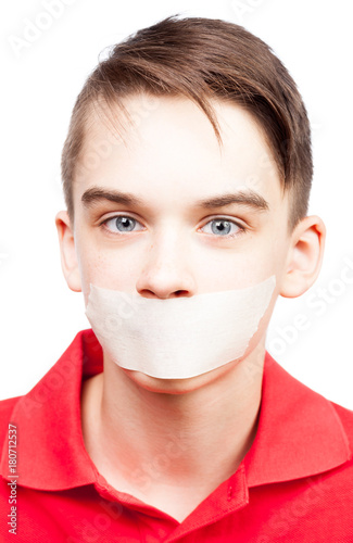 Fényképezés Speechless teen boy with tape over his mouth
