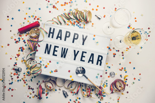 Happy New year displayed on a vintage lightbox with decoration for New Year's Ev Wallpaper Mural