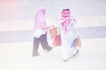 Wall Mural - Young muslim couple shopping