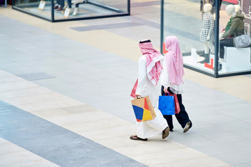 Wall Mural - Young muslim couple shopping