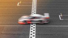 Motion Blur Race Car Racing On Speed Track, Super Car Race On The International Race Track Crossing Start And Finish Line With Motion Blur, Automobile And Automotive Transportation Vehicle Background.