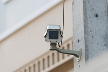 Surveillance Camera.CCTV Installment On Public Electrical Pole With Infrared Red Light, Front View.
