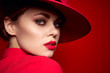 © SHOTPRIME STUDIO - beautiful woman in a red hat close-up