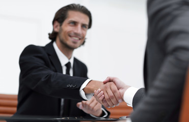 handshake Manager and the client sitting in the office