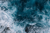 Fototapeta Morze - Aerial view to ocean waves. Blue water background