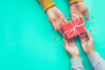  Male gives a gift to female with copy space background.happiness moment concepts