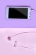 tablet with headphones on purple pink background