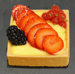 Wall Mural - greedy pastry with currant blackberry strawberries