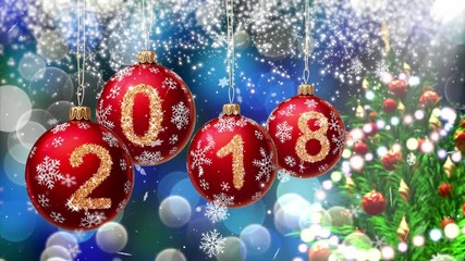 Wall Mural - red balls with numbers 2018 hanging on the background of a blue bokeh and a rotating christmas tree 