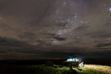 Wall Mural - Camping site on top of a hill with starry night in Gran Sabana region, Venezuela