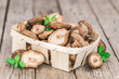 Wooden table with Shiitake mushrooms, selective focus