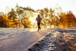 © baranq - Man out running in the park on sunny autumn morning