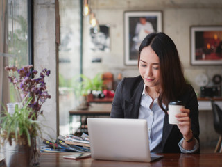 Wall Mural - Asian business woman with laptop happy and smile concept success work