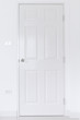 White door on white wall with stainless door knob,Handle on white wood door,Close Up white door interior