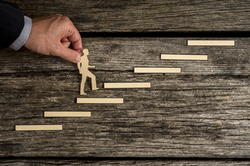 Wall Mural - Businessman climbing the steps to success