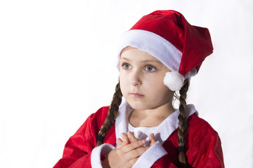 Little caucasian girl dressed as Santa Claus.