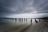 Fototapeta Morze - Old Pier on Cloudy Day Landscape