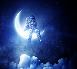 Wall Mural - astronaut sit on crescent moon. mixed media