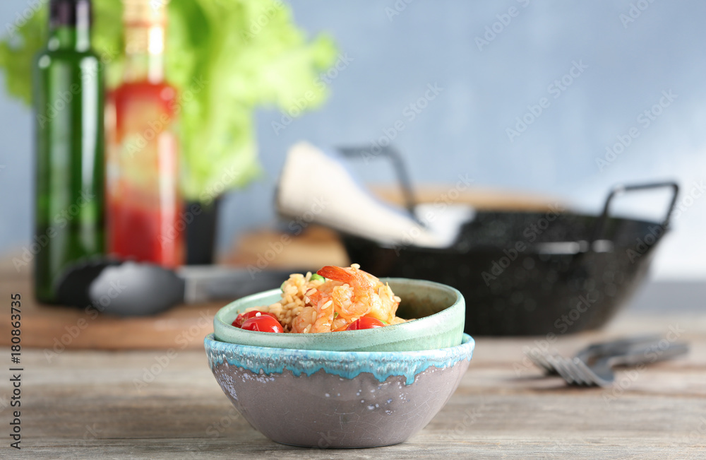 Bowls with delicious shrimp fried rice on table