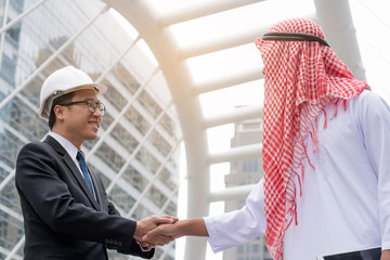 business success concept : arab business people meeting team partner ,happy hand shake communication