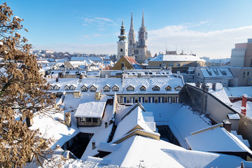 View over Zagreb during winter with snow with view to towers of church and cathedral at a sunny day, Zagreb, Croatia, Europe