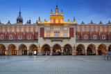 Fototapeta Psy - The Krakow Cloth Hall on the Main Square at dusk, Poland