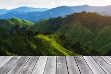 Wooden Floor Terrace Or Plank Desk With Beautiful Sunset In The Mountain, Landscape Nature Background, Copy Space For Display Of Product Or Object Presentation