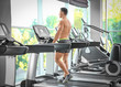 © Africa Studio - Muscular man training in gym
