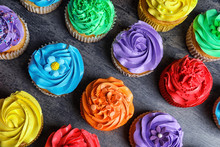 Tasty Colorful Cupcakes On Table