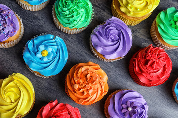 Poster - Tasty colorful cupcakes on table