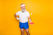 © deagreez - Competetive emotional cool active comic grandpa with beaming grin, with table tennis equipment. Healthcare, weight loss, bodycare lifestyle, wearing blue sexy shorts, so hot!