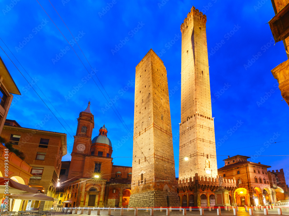 Two Towers, Asinelli and Garisenda, both of them leaning, symbol of Bologna, statue of San Petronius and Church of Saints Bartholomew and Gaetano in the morning, Bologna, Emilia-Romagna, Italy - obrazy, fototapety, plakaty 