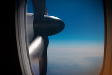 View Of Turboprop Plane Propeller Seen Through The Window During Flight