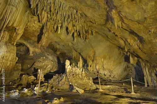 Warm Tones Of Stalactites And Stalagmites In Cave Is A