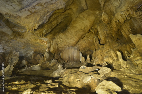 Warm Tones Of Stalactites And Stalagmites In Cave Is A