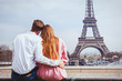 © Song_about_summer - romantic holidays in France, couple sitting together near Eiffel tower in Paris, honeymoon travel