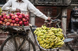 bananas and apples on a bike on a street market