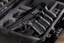 Black Handgun In Plastic Secure Storage Case