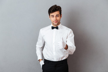 Sticker - Portrait of a smiling young male waiter