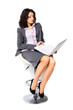 © Ольга  - Business woman portrait. The brunette is walking on a high chair. He holds a a laptop. Isolated
