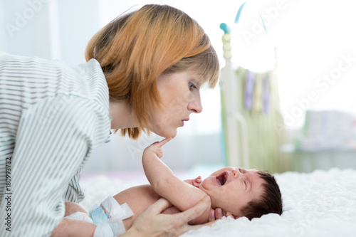 Mother Comforts Her Crying Newborn Baby Buy This Stock Photo And