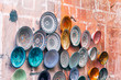 colorful pottery plates hanging at wall,