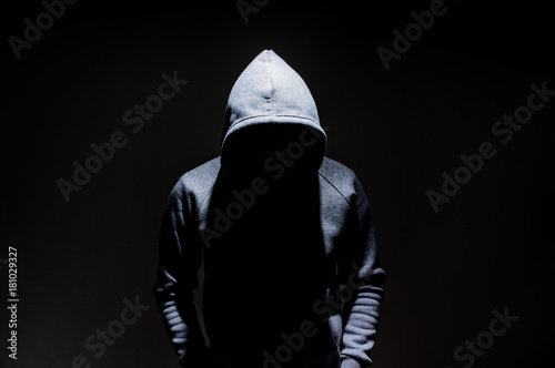 Fotomural Silhouette of man in the hood, dark mysterious man hoodie, murderer, hacker, ano