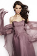 © EVGENY FREEONE - Brunette in a long dress posing