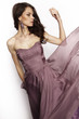 © EVGENY FREEONE - Brunette in a long dress posing