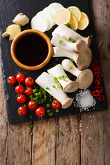 Wall Mural - Raw fresh king oyster mushrooms and vegetables, spices and soy sauce close-up. Vertical top view