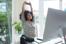 Graphic Designer Stretching Her Arms