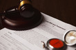 © burdun - Last will and testament with wooden judge gavel; document is mock-up not real