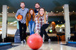 © NDABCREATIVITY - Friends enjoying bowling at club