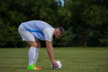 Wall Mural - Football player ready to kick the soccer ball